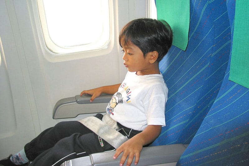Little boy in airplane seat