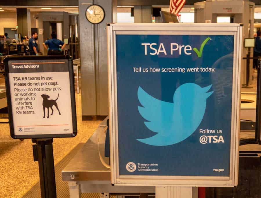 The twitter logo and an information board on an airport