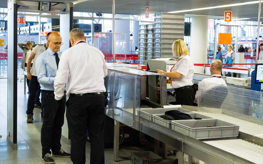 Passengers getting check on the airport's security check