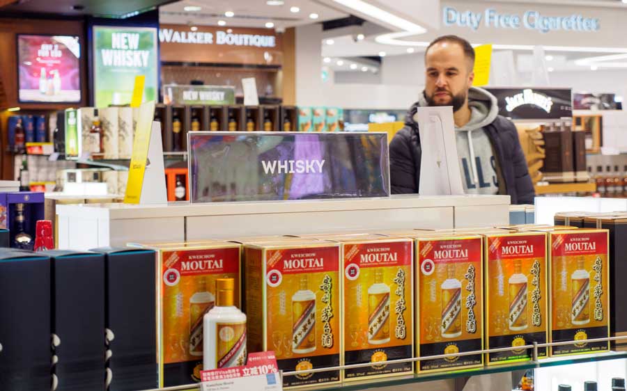 A man looking for alcoholic drinks in Duty Free