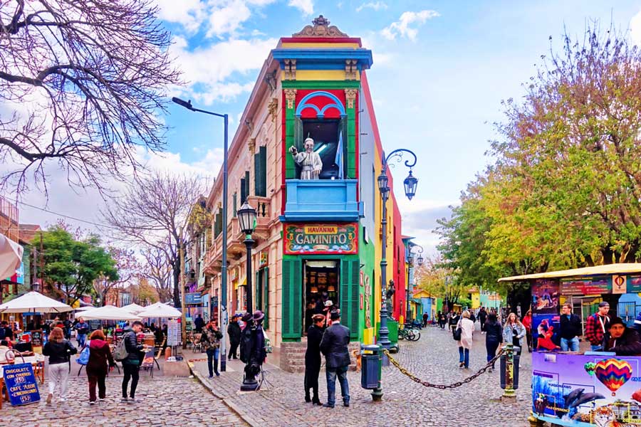 View of people and a colorful building at the El Caminito, Buenos Aires